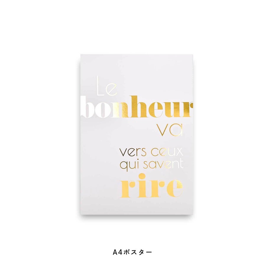 ゴールド文字でLe bonheur va vers ceux qui savent rireと書かれたポスター